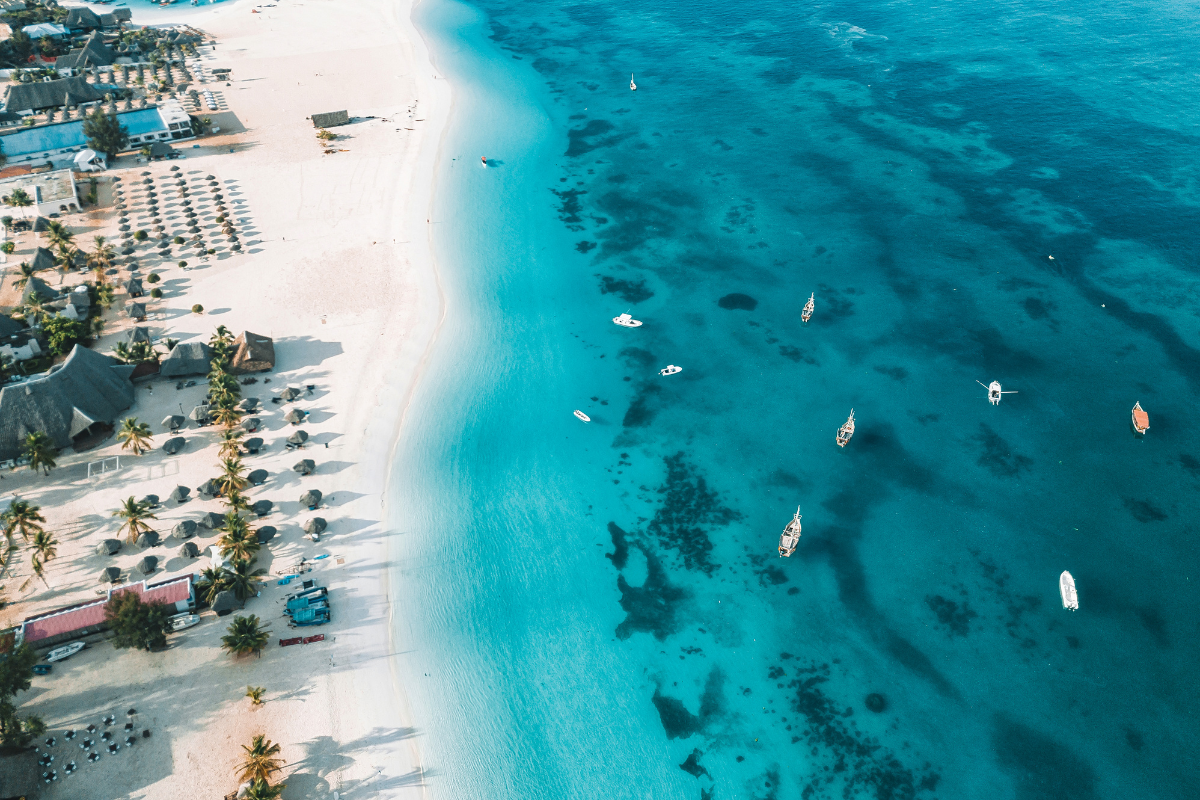 Traditional dhow sailing on turquoise water off Zanzibar