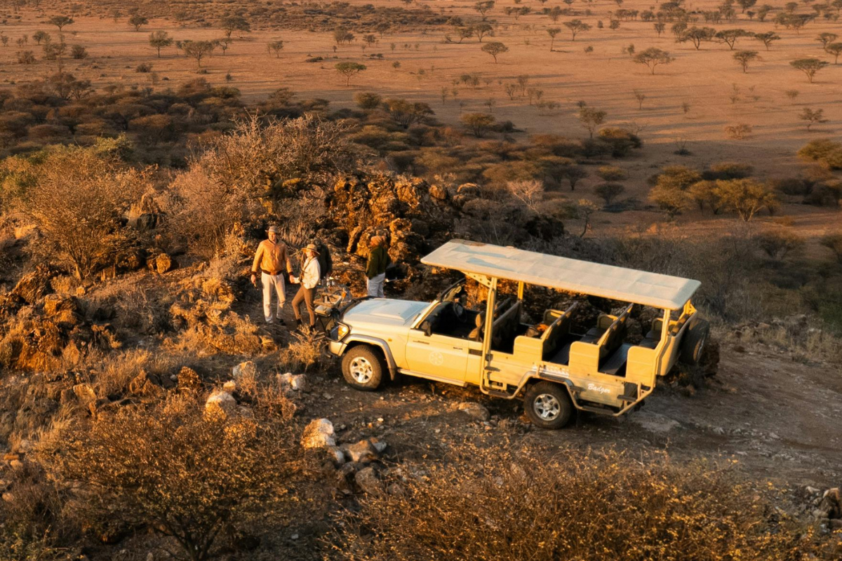 Family silhouetted against a safari sunset